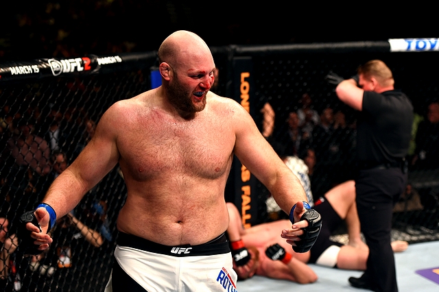 NEWARK, NJ - JANUARY 30: (L-R) Ben Rothwell celebrates his submission victory over Josh Barnett in their heavyweight bout during the UFC Fight Night event at the Prudential Center on January 30, 2016 in Newark, New Jersey. (Photo by Josh Hedges/Zuffa LLC/Zuffa LLC via Getty Images)